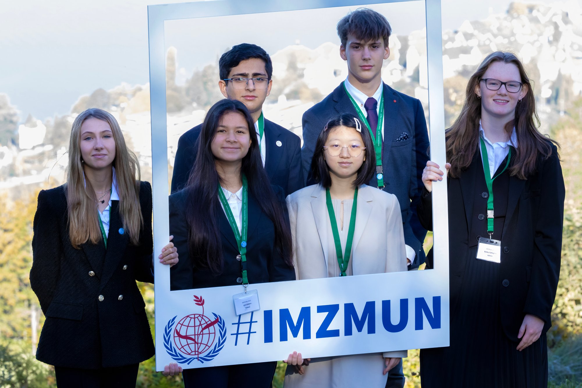 A group of students with IMZ MUN sign.