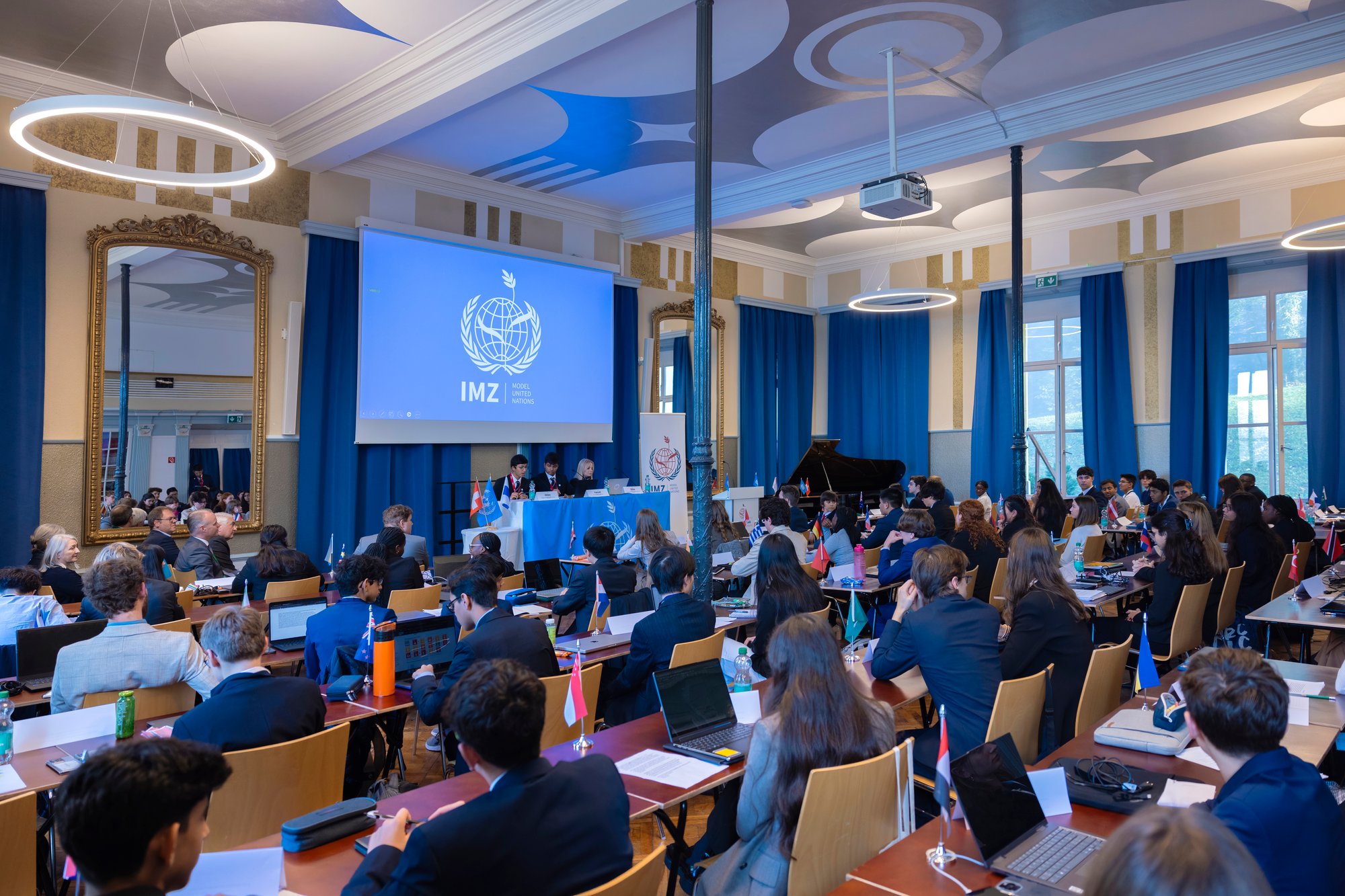 Model united nations conference atmosphere taken from behind.